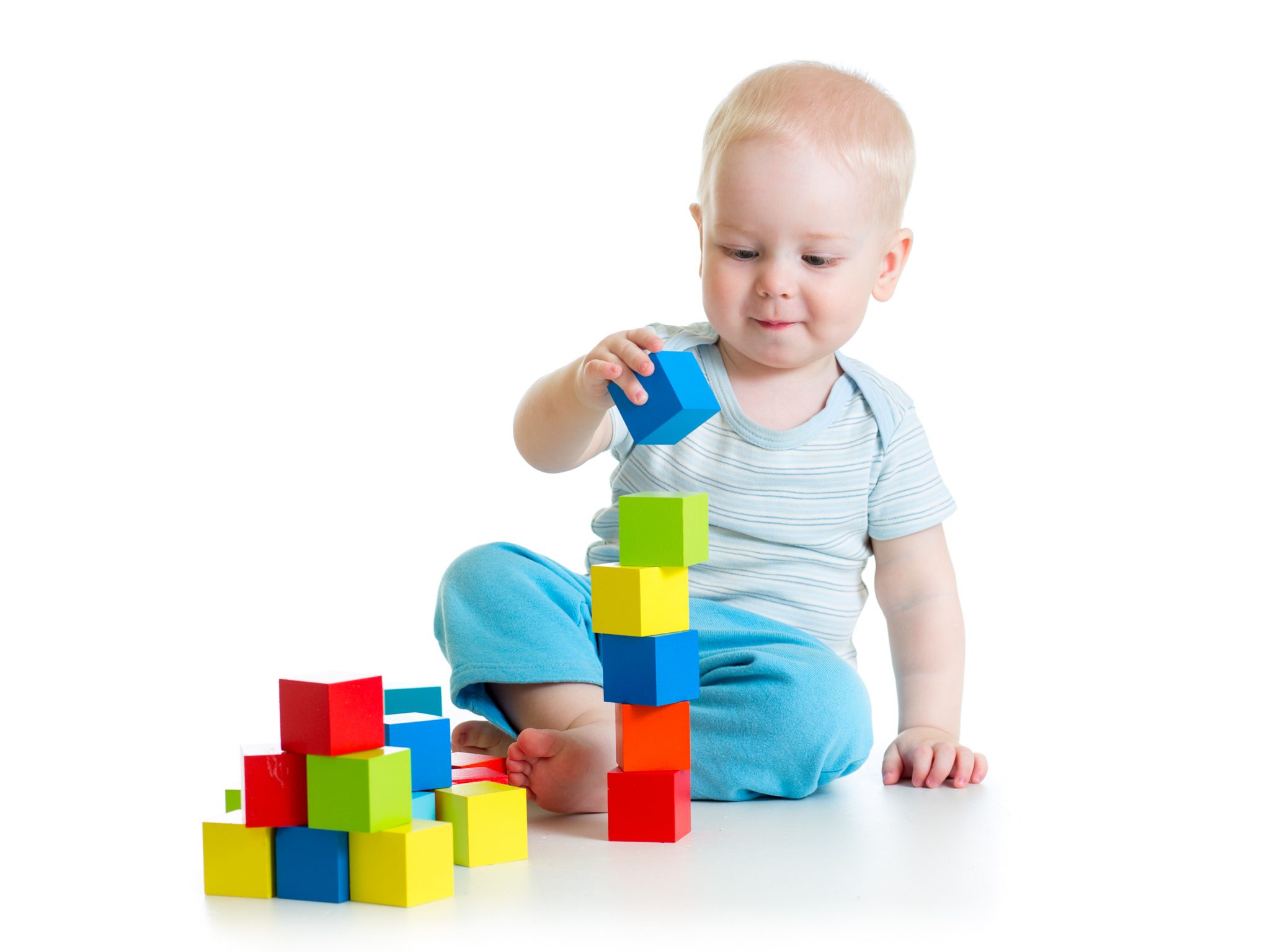 babies stacking blocks
